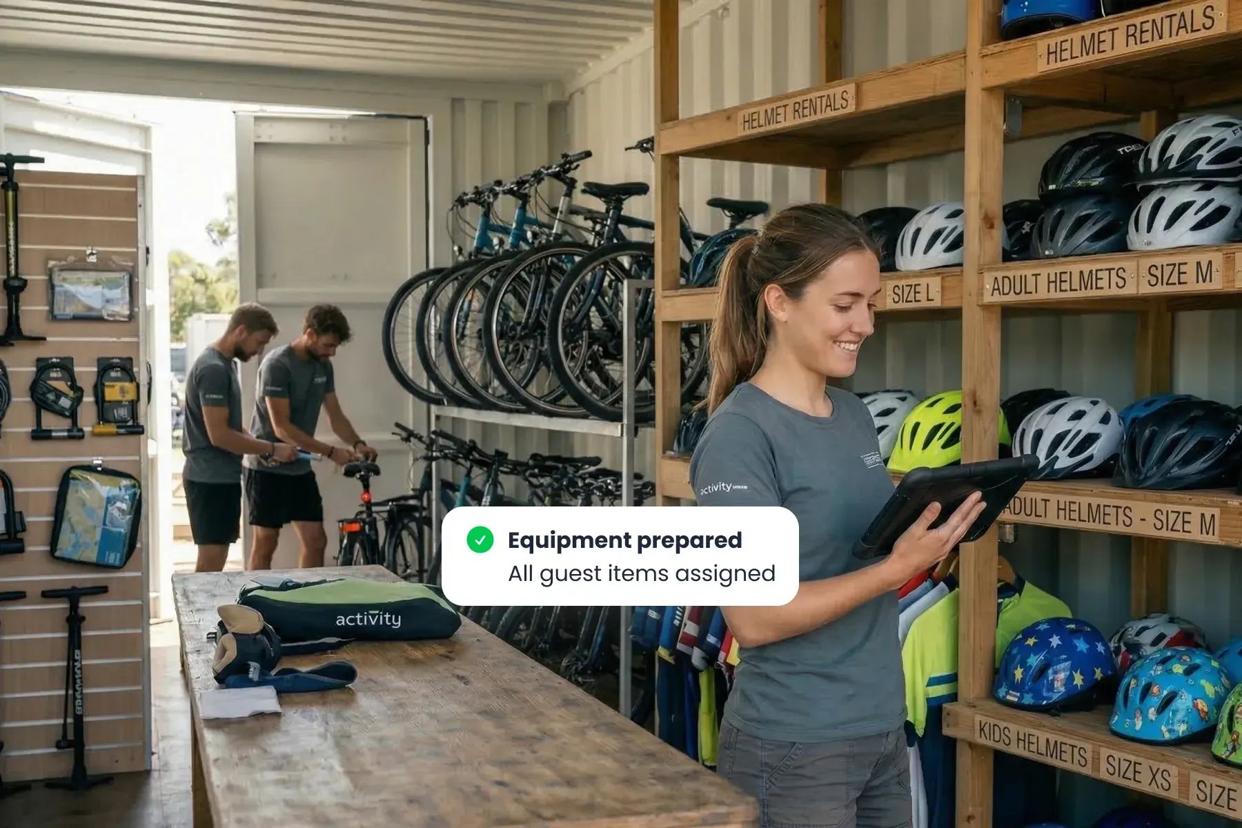 Staff member using Bloowatch to assign bikes and equipment for each rental booking.