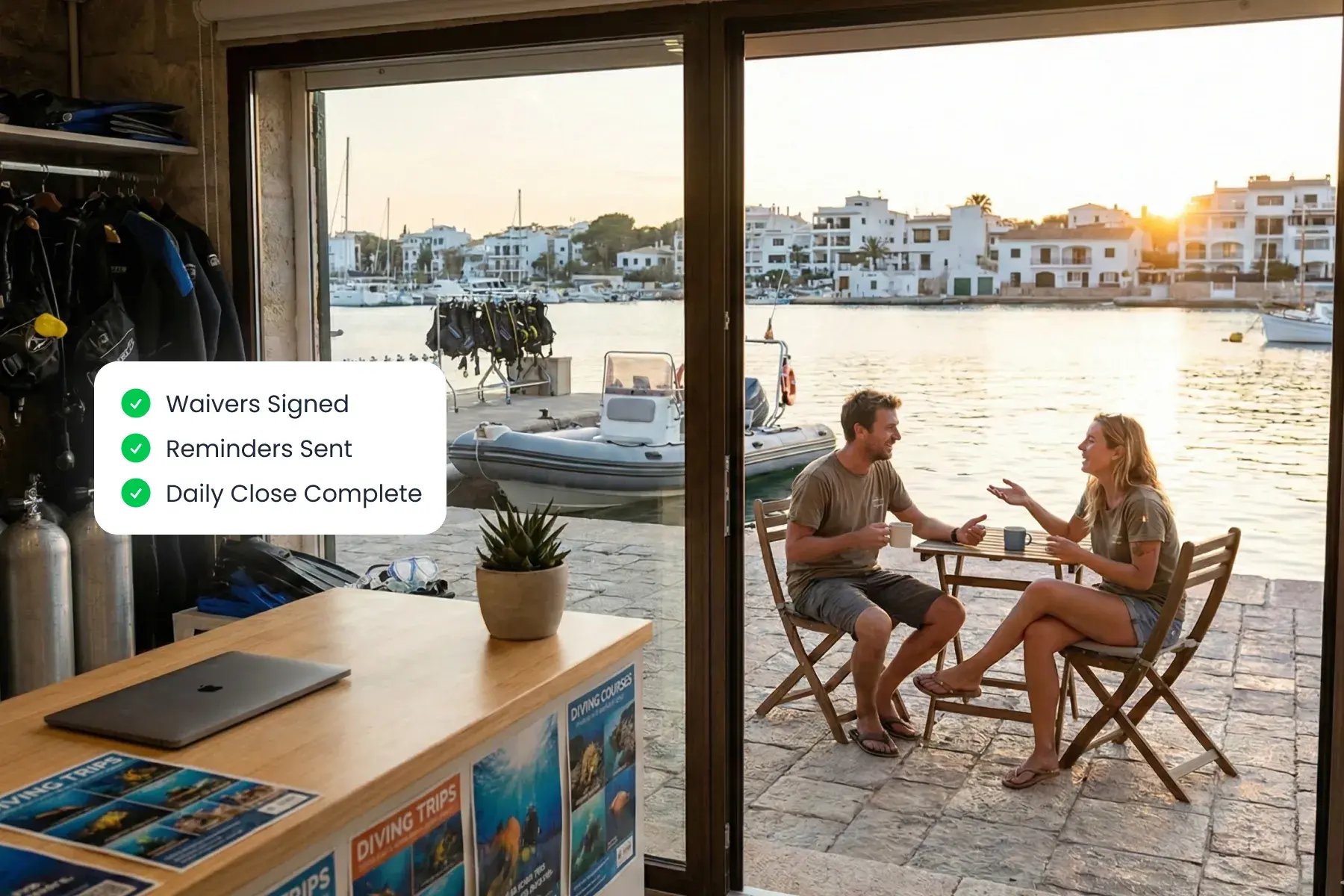 Dive center outdoor terrace with Bloowatch automation dashboard on screen, reducing manual admin for dive operations