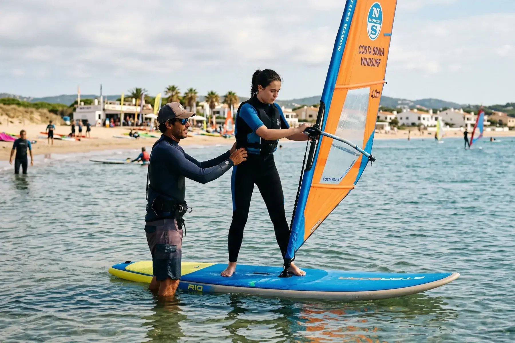 Windsurf coach organizing a lesson together with clients with Bloowatch