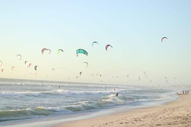 beach-with-many-people-busy-wind-surfing-2024-12-05-15-24-40-utc