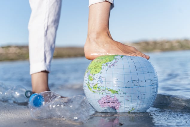 earth with a foot